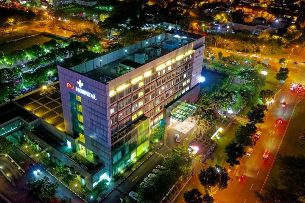 How Hospitals Can Improve Cybersecurity to Protect Patient Data? 1 hospital beside vehicle park and road at night
