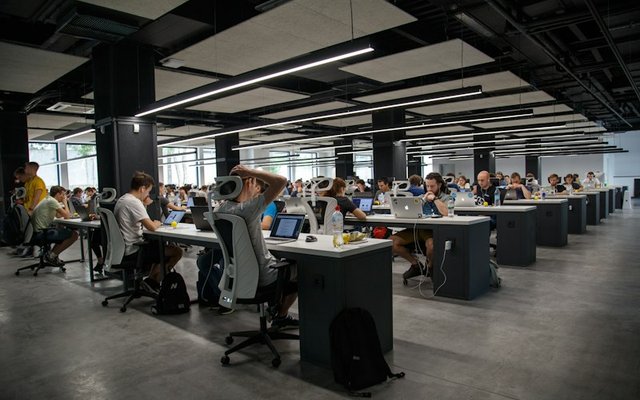 Network operations center NOC engineers monitoring client server telemetry