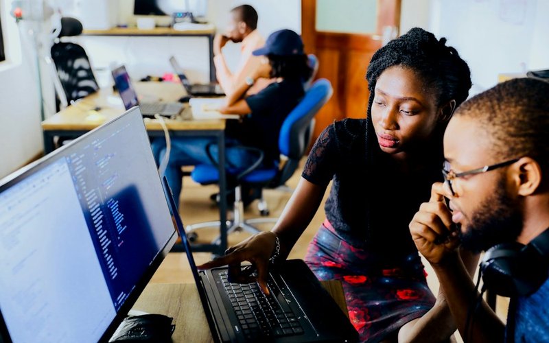 Business PC Support engineering team collaborating on client infrastructure